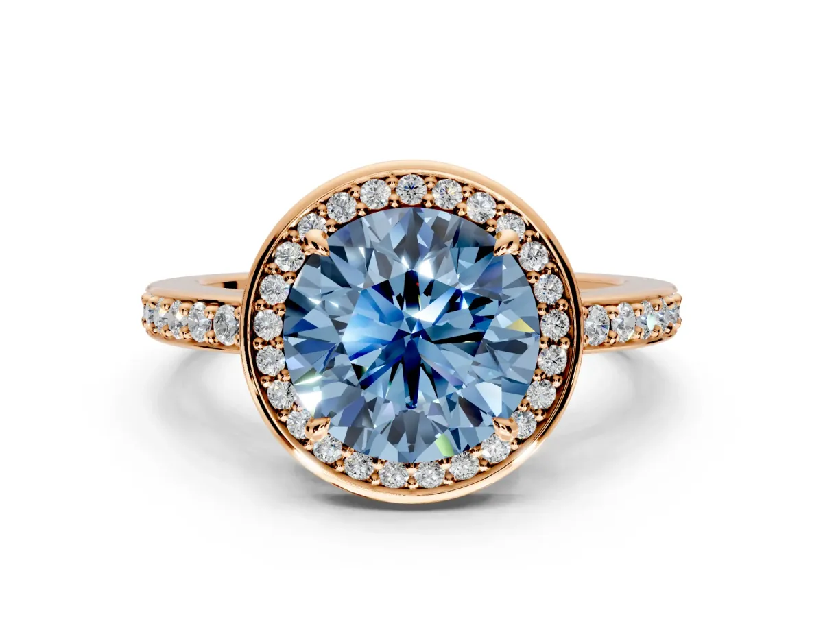 Halo Engagement Ring Setting for Fancy Blue Round Cut Center with Metal-Rimmed Halo, Pave Band and Prong Head in Rose Gold