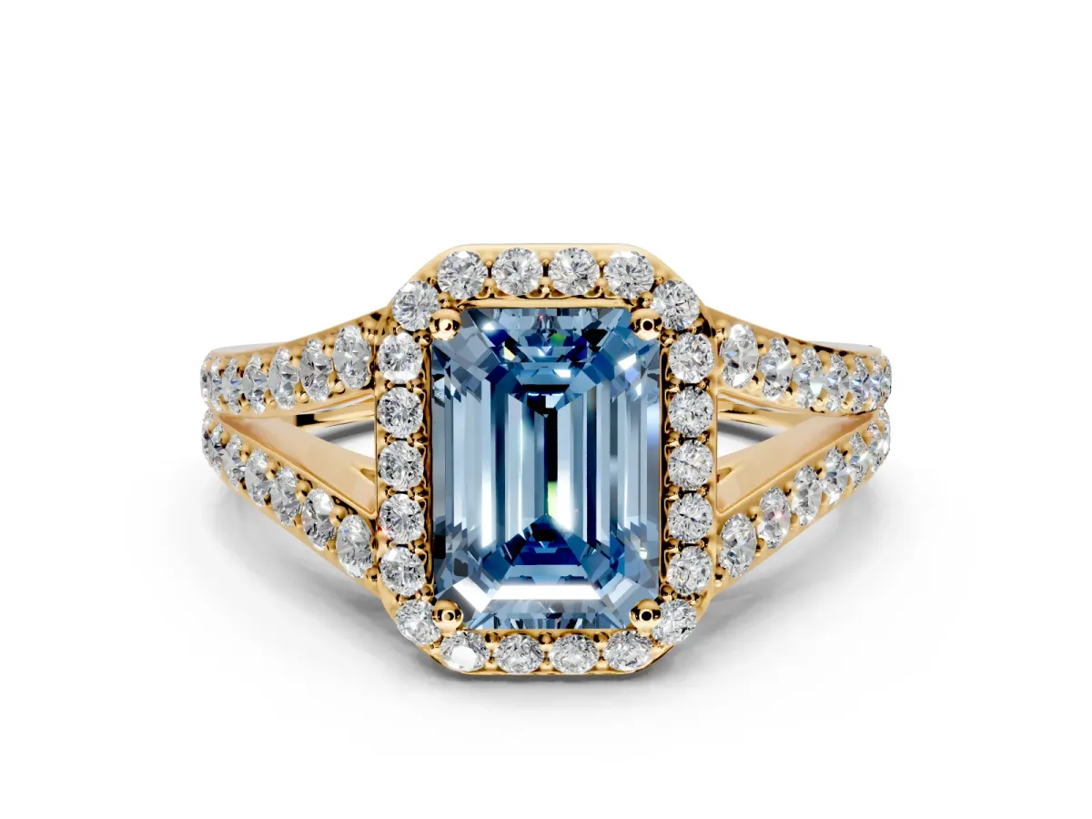 Halo Engagement Ring Setting for Fancy Blue Emerald Cut Center with Narrow Pave Split Shank and Prong Head in Yellow Gold