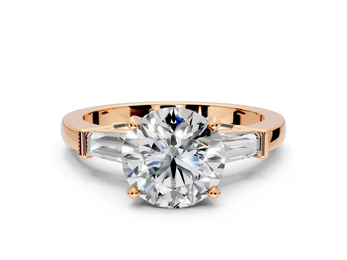 3 Stone Engagement Ring Setting for Round Cut Center with Channel Baguette Accents and Prong Head in Rose Gold
