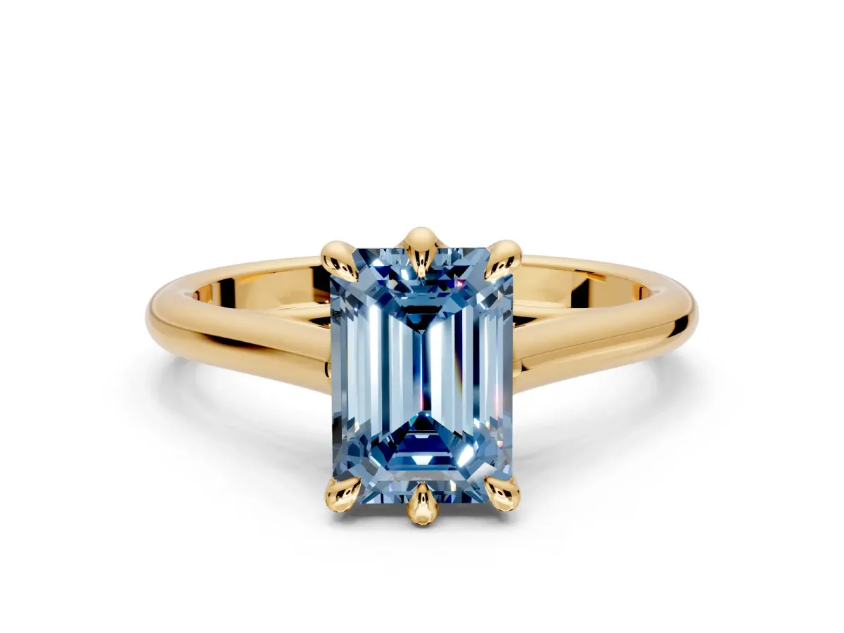 Solitaire Engagement Ring Setting for Fancy Blue Emerald Cut Center with Cathedral Band and Prong Head in Yellow Gold