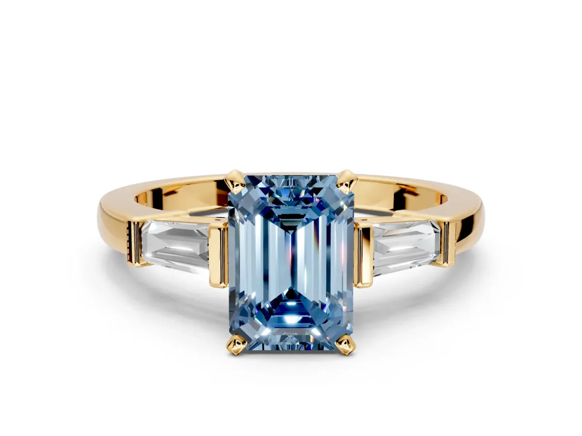 3 Stone Engagement Ring Setting for Fancy Blue Emerald Cut Center with Channel Baguette Accents and Prong Head in Yellow Gold