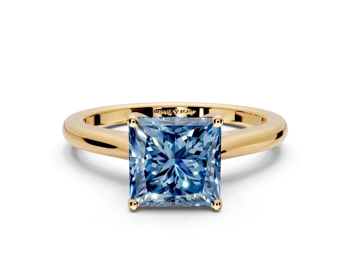 Solitaire Engagement Ring Setting for Fancy Blue Princess Cut Center with Narrow Cathedral Band and Prong Head in Yellow Gold