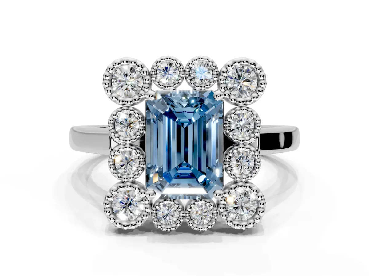 Cluster Halo Engagement Ring Setting for Fancy Blue Emerald Cut Center with Milgrain Bezel Accents and Prong Head in White Gold