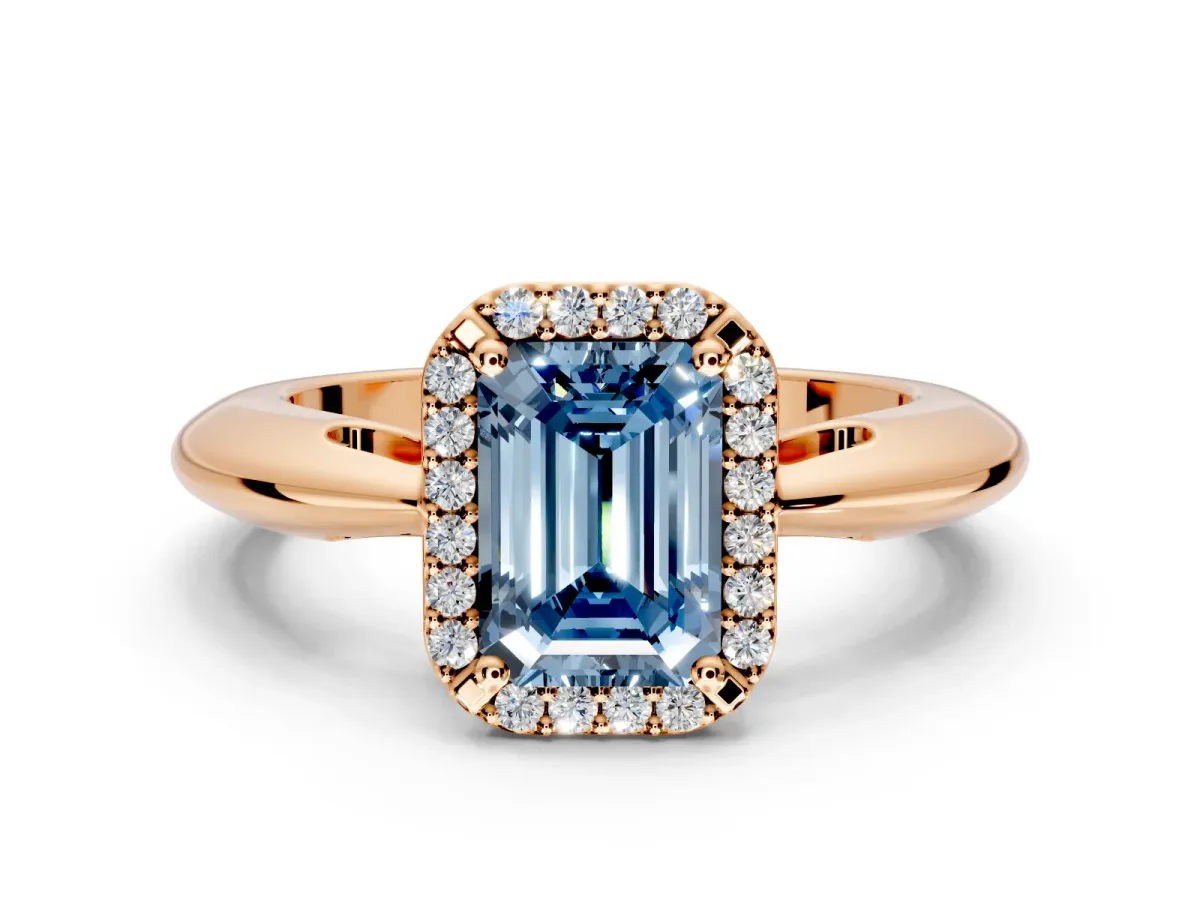 Halo Engagement Ring Setting for Fancy Blue Emerald Cut Center with Tapered Plain Band and Prong Head in Rose Gold