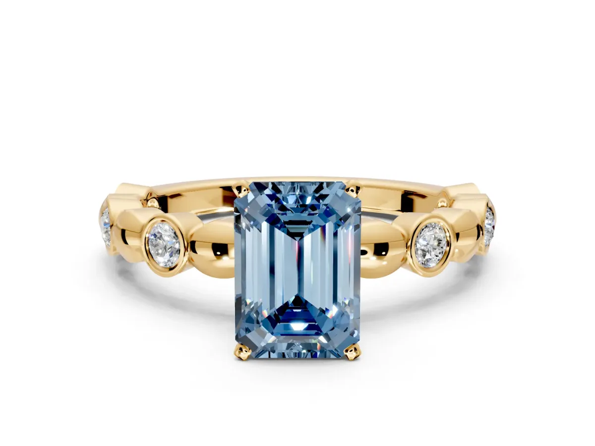 Solitaire Engagement Ring Setting for Fancy Blue Emerald Cut Center with Beaded Bezel Station Band and Prong Head in Yellow Gold