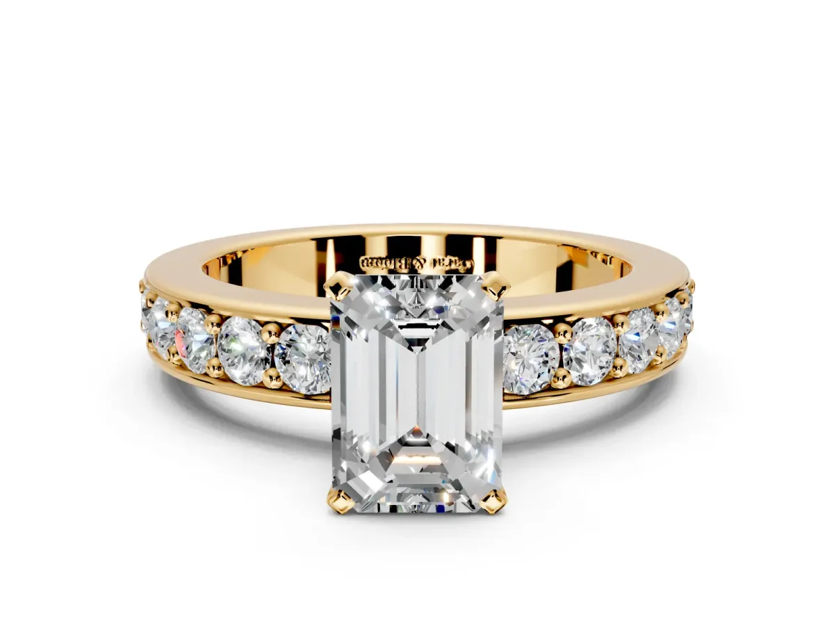 Solitaire Engagement Ring Setting for Emerald Cut Center with Channel-Set Accents and Prong Head in Yellow Gold