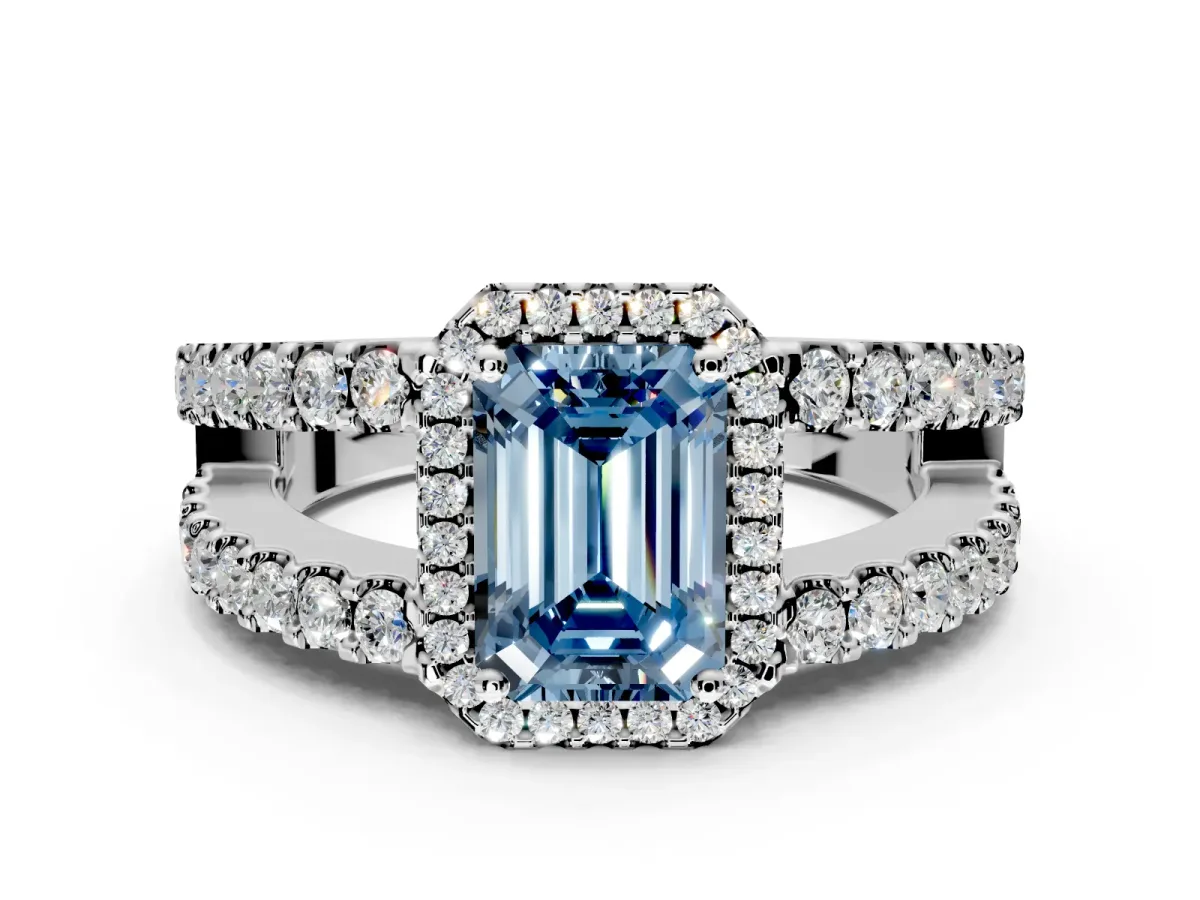Halo Engagement Ring Setting for Fancy Blue Emerald Cut Center with Wide-Open Pave Split Shank and Prong Head in Platinum