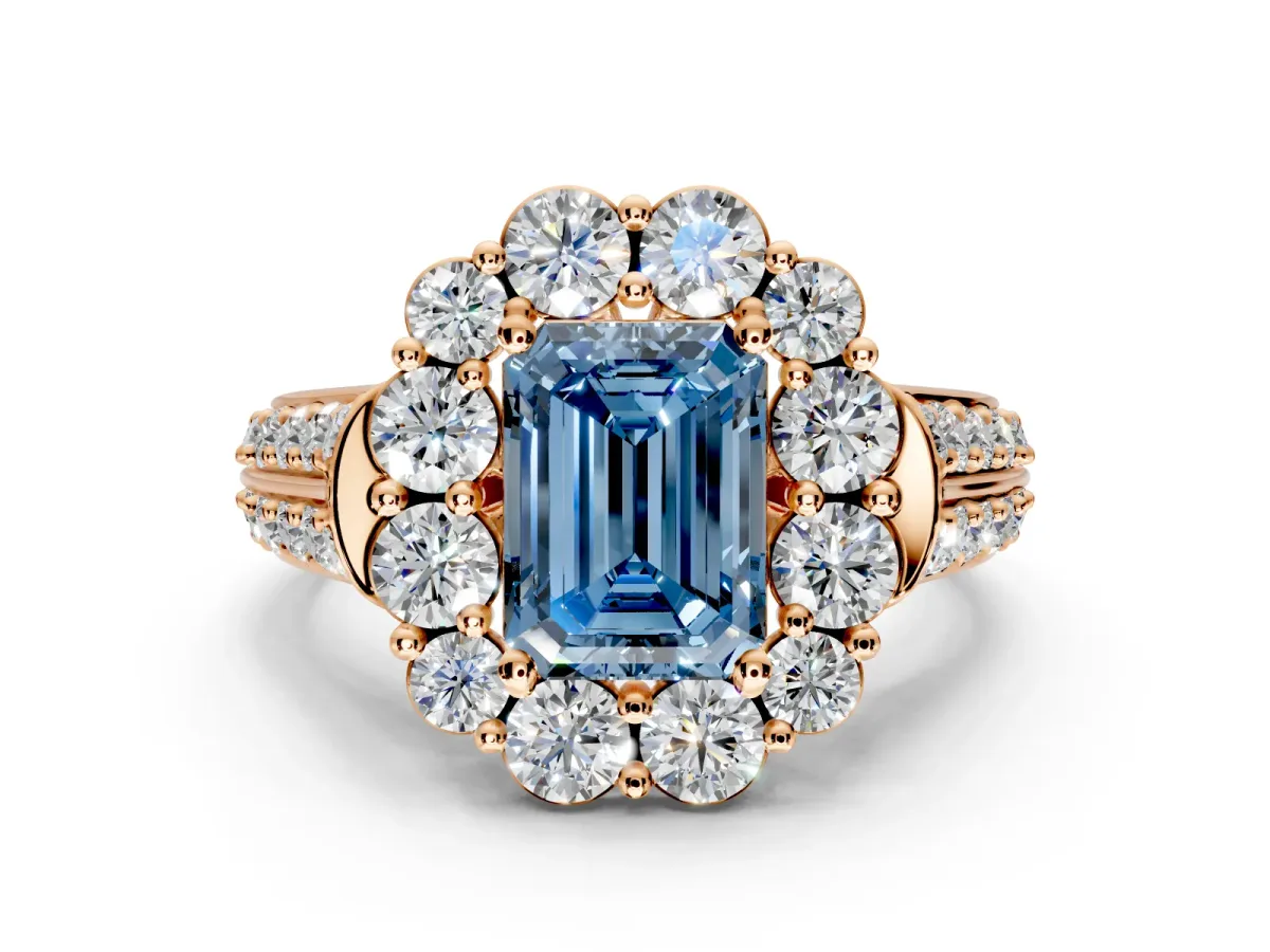 Large Accent Halo Engagement Ring Setting for Fancy Blue Emerald Cut Center with Pave Split Shank and Prong Head in Rose Gold