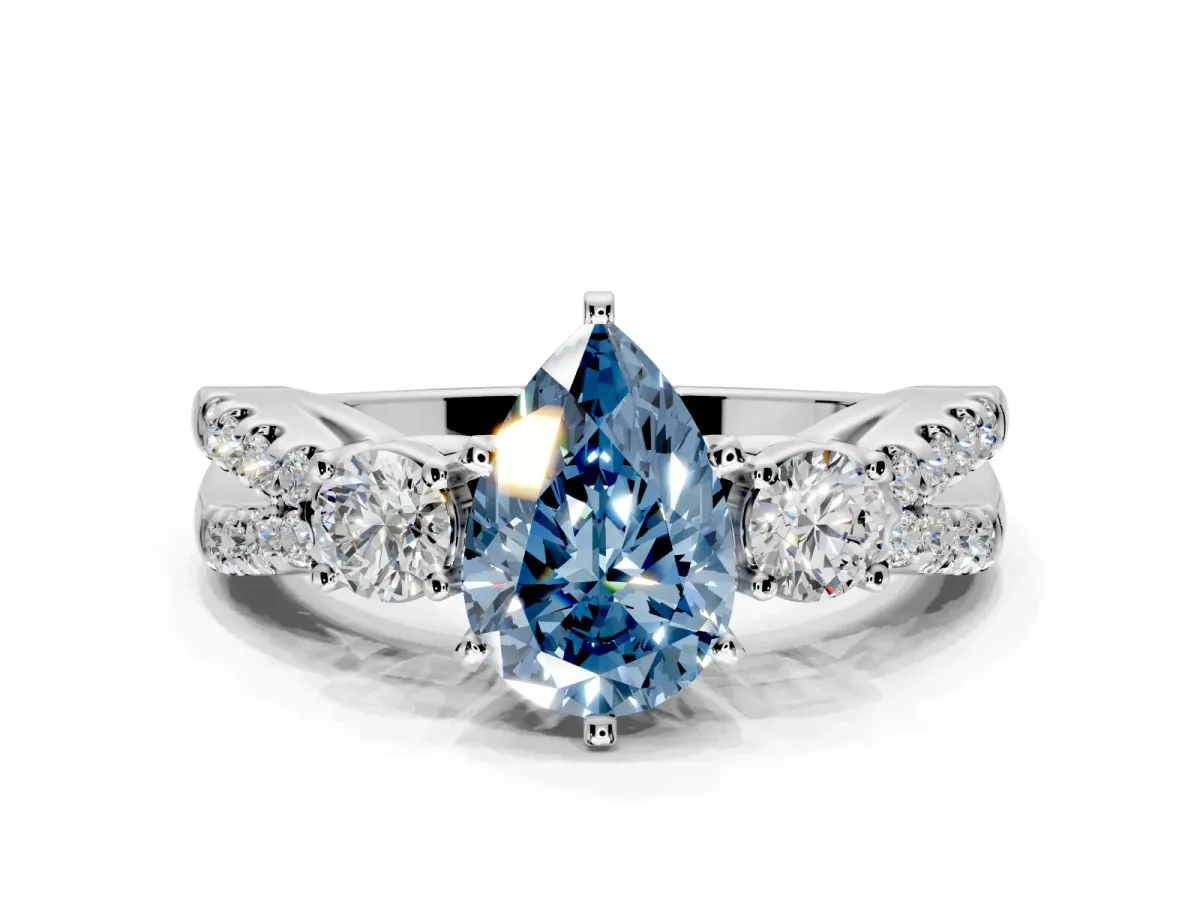 3 Stone Engagement Ring Setting for Fancy Blue Pear-Shaped Center with Pave Split Shank and Prong Head in White Gold
