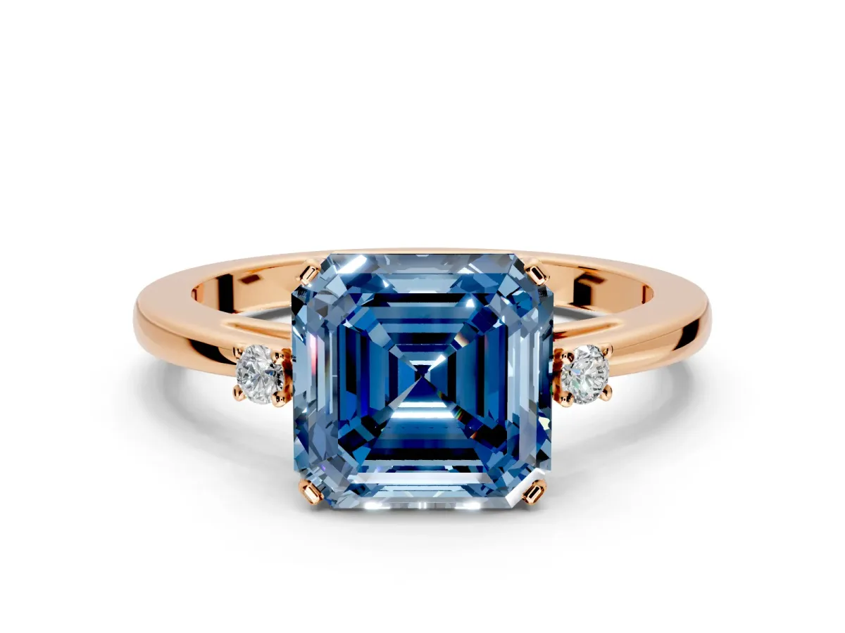 3 Stone Engagement Ring Setting for Fancy Blue Asscher Cut Center with Low-Set Round Cut Accents and Prong Head in Rose Gold