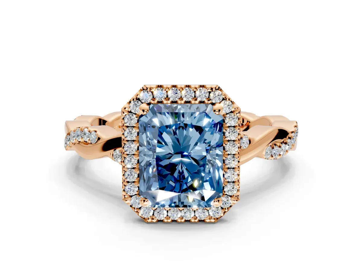 Halo Engagement Ring Setting for Fancy Blue Radiant Cut Center with Pave and Plain Twist Band and Prong Head in Rose Gold