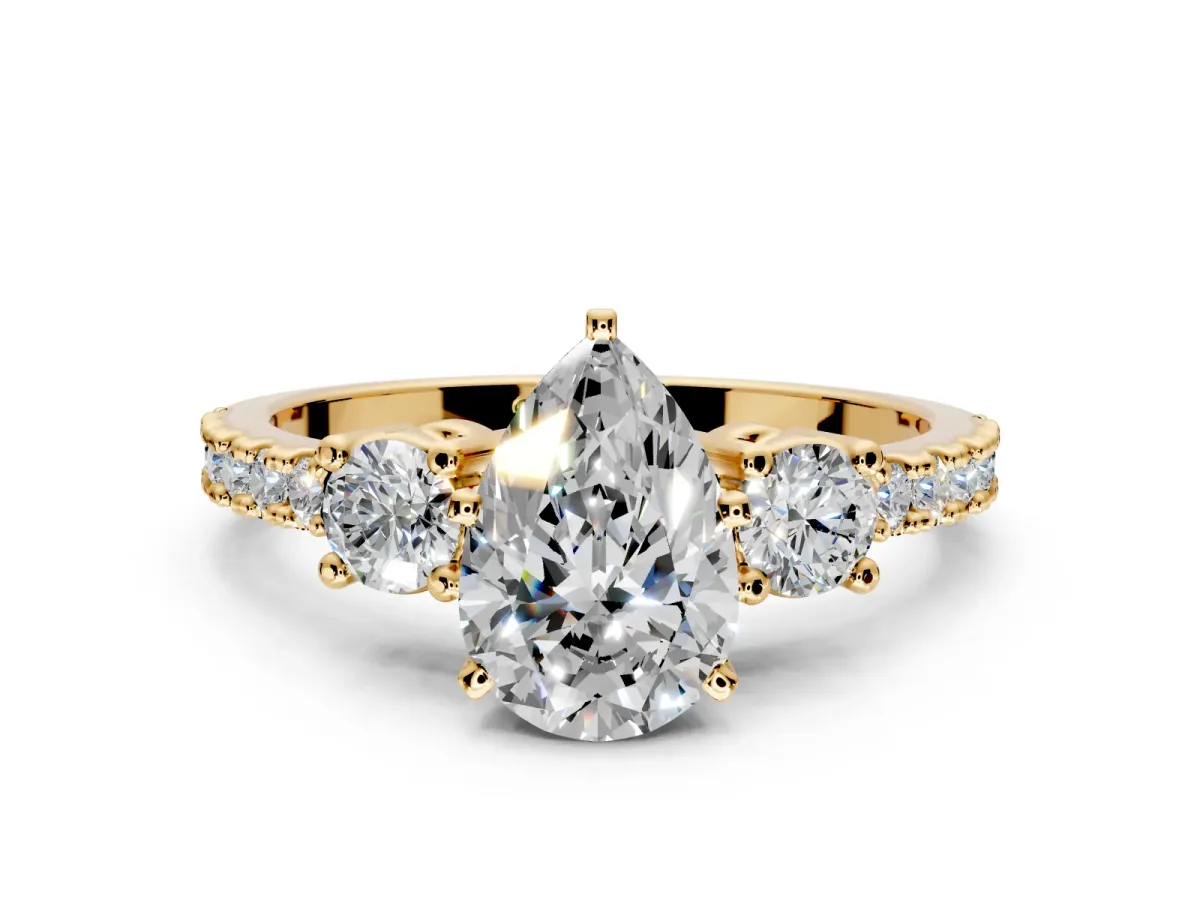 3 Stone Engagement Ring Setting for Pear-Shaped Center with Round Cut Side Accents and Prong Head in Yellow Gold