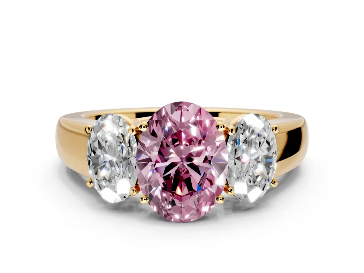3 Stone Engagement Ring Setting for Fancy Pink Oval Center with Raised Basket Heads and Prong Head in Yellow Gold