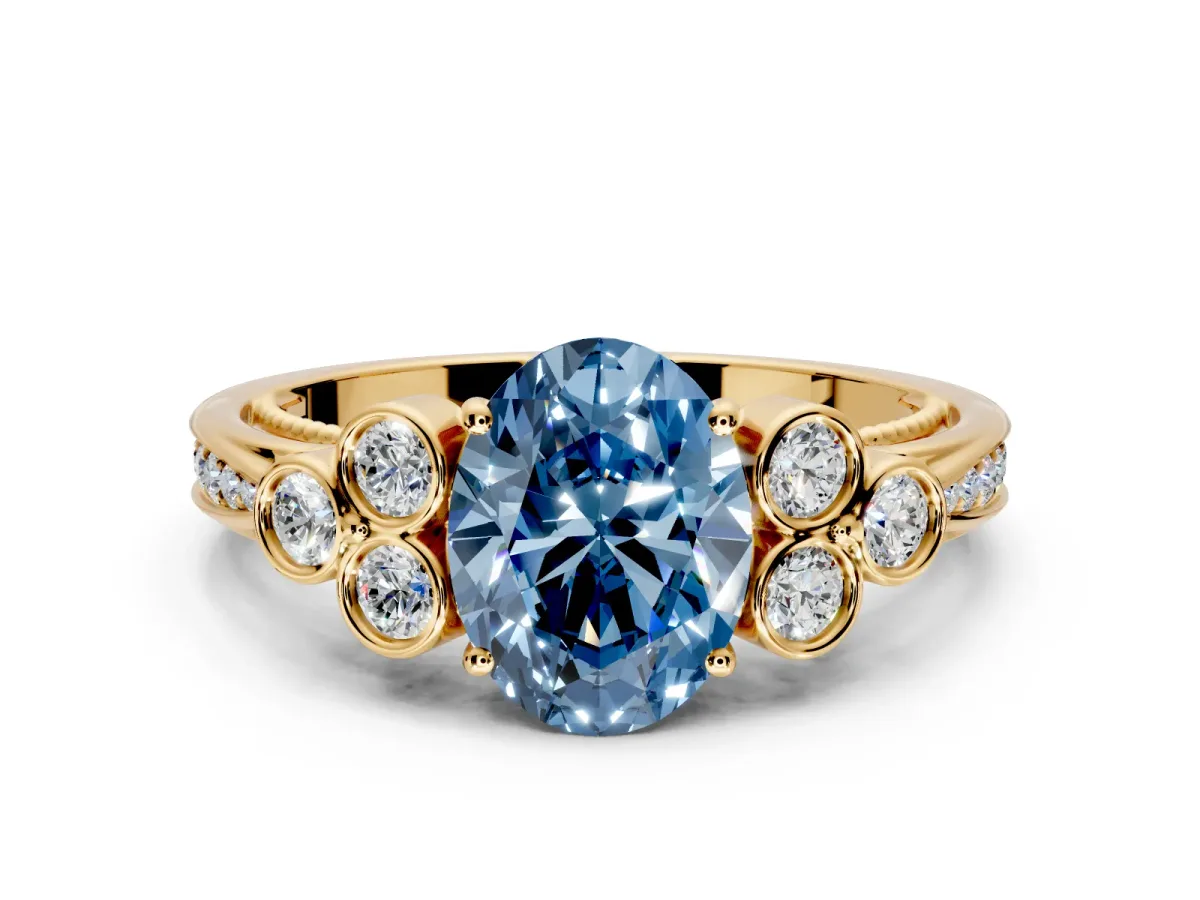 Cluster Engagement Ring Setting for Fancy Blue Oval Center with Bezel Accent Clusters and Prong Head in Yellow Gold