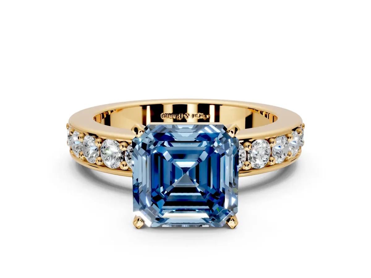 Solitaire Engagement Ring Setting for Fancy Blue Asscher Cut Center with Channel-Set Accents and Prong Head in Yellow Gold