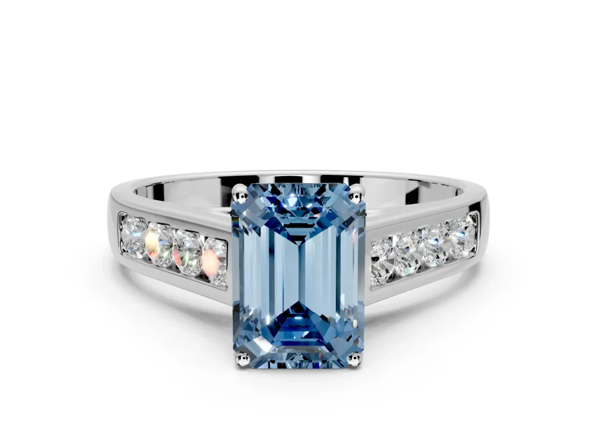Solitaire Engagement Ring Setting for Fancy Blue Emerald Cut Center with Round Cut Channel Band and Prong Head in Sterling Silver