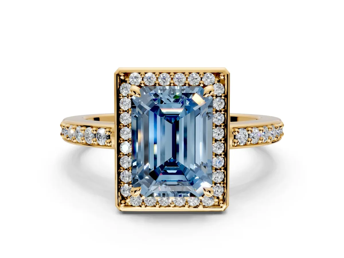 Halo Engagement Ring Setting for Fancy Blue Emerald Cut Center with Metal-Rimmed Halo, Pave Band and Prong Head in Yellow Gold