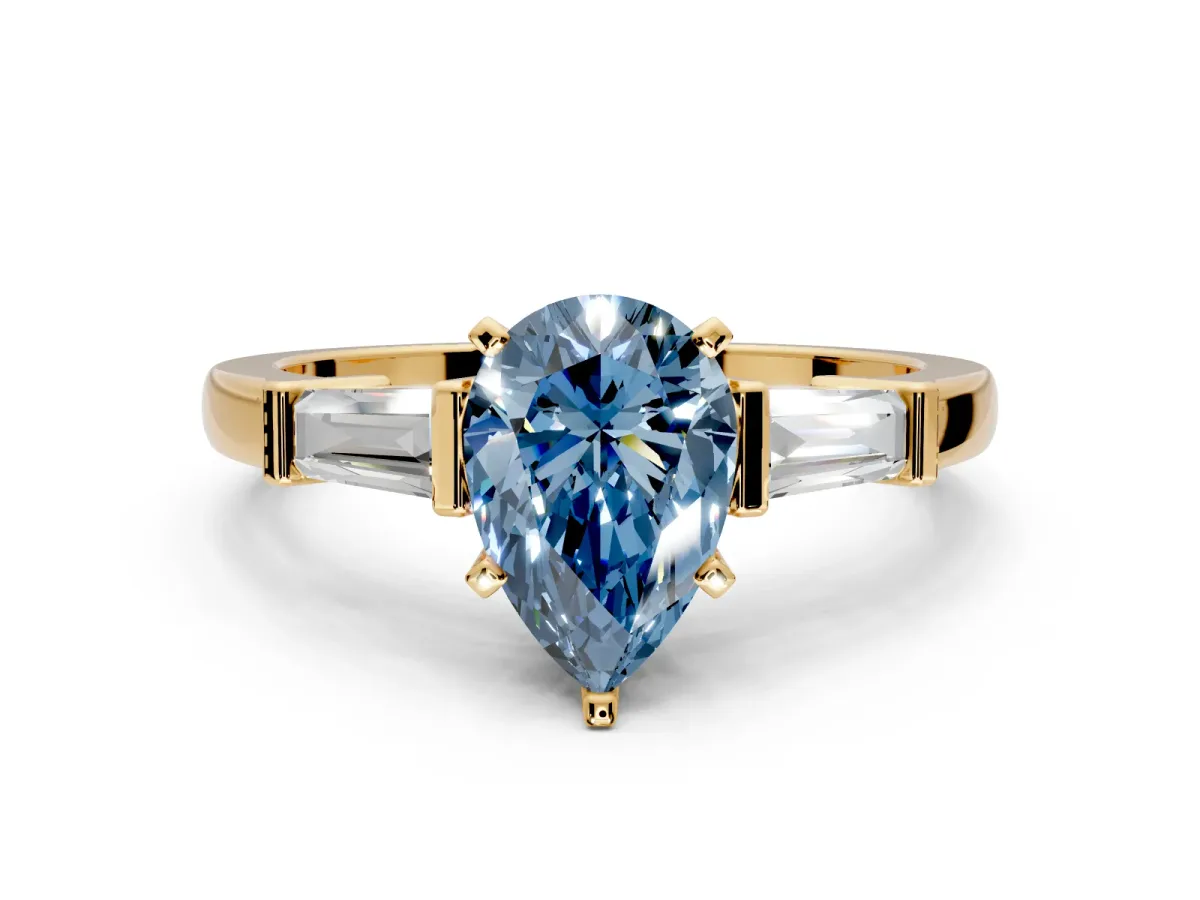 3 Stone Engagement Ring Setting for Fancy Blue Pear-Shaped Center with Channel Baguette Accents and Prong Head in Yellow Gold