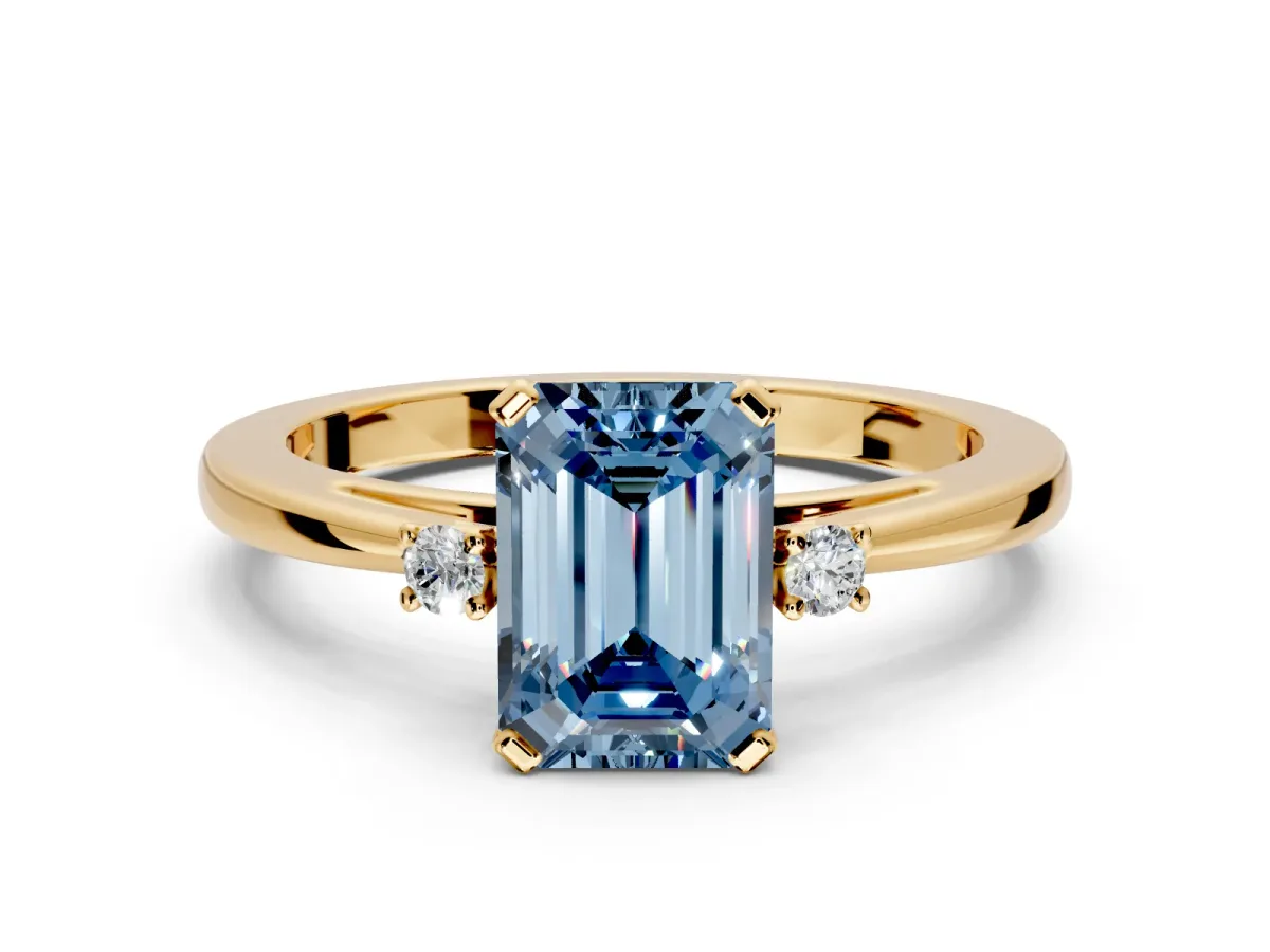 3 Stone Engagement Ring Setting for Fancy Blue Emerald Cut Center with Low-Set Round Cut Accents and Prong Head in Yellow Gold