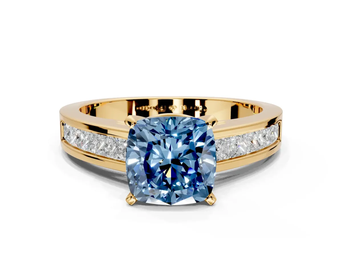 Solitaire Engagement Ring Setting for Fancy Blue Cushion Cut Center with Princess Cut Channel Band and Prong Head in Yellow Gold