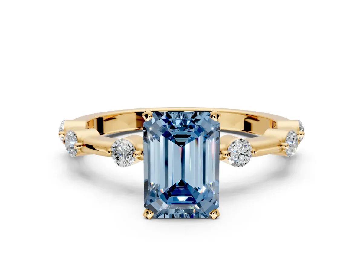 Solitaire Engagement Ring Setting for Fancy Blue Emerald Cut Center with Bezel Station Band and Prong Head in Yellow Gold