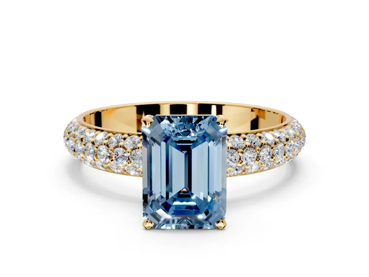 Solitaire Engagement Ring Setting for Fancy Blue Emerald Cut Center with Domed Multi-Row Pave Band and Prong Head in Yellow Gold