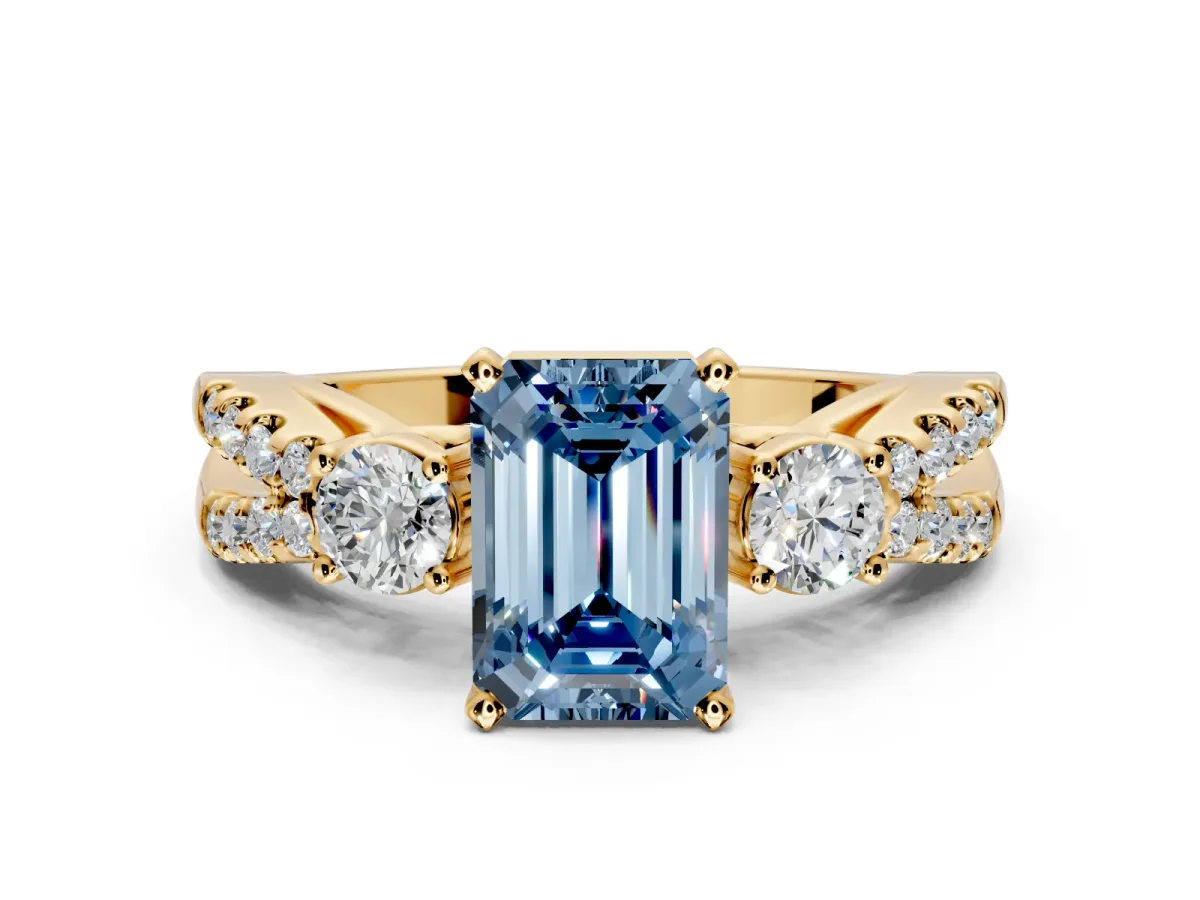3 Stone Engagement Ring Setting for Fancy Blue Emerald Cut Center with Pave Split Shank and Prong Head in Yellow Gold