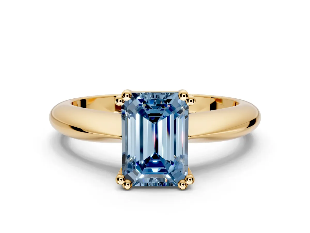 Solitaire Engagement Ring Setting for Fancy Blue Emerald Cut Center with Reverse Tapered Band and Prong Head in Yellow Gold