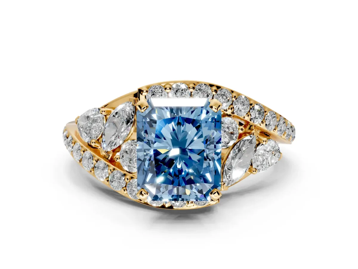 Halo Engagement Ring Setting for Fancy Blue Radiant Cut Center with Marquise and Pave Bypass Band and Prong Head in Yellow Gold