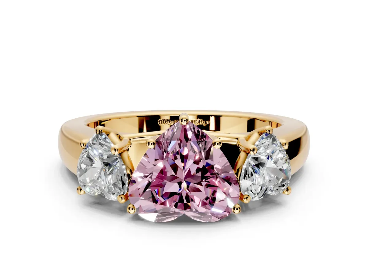 3 Stone Engagement Ring Setting for Fancy Pink Heart-Shaped Center with Raised Basket Heads and Prong Head in Yellow Gold