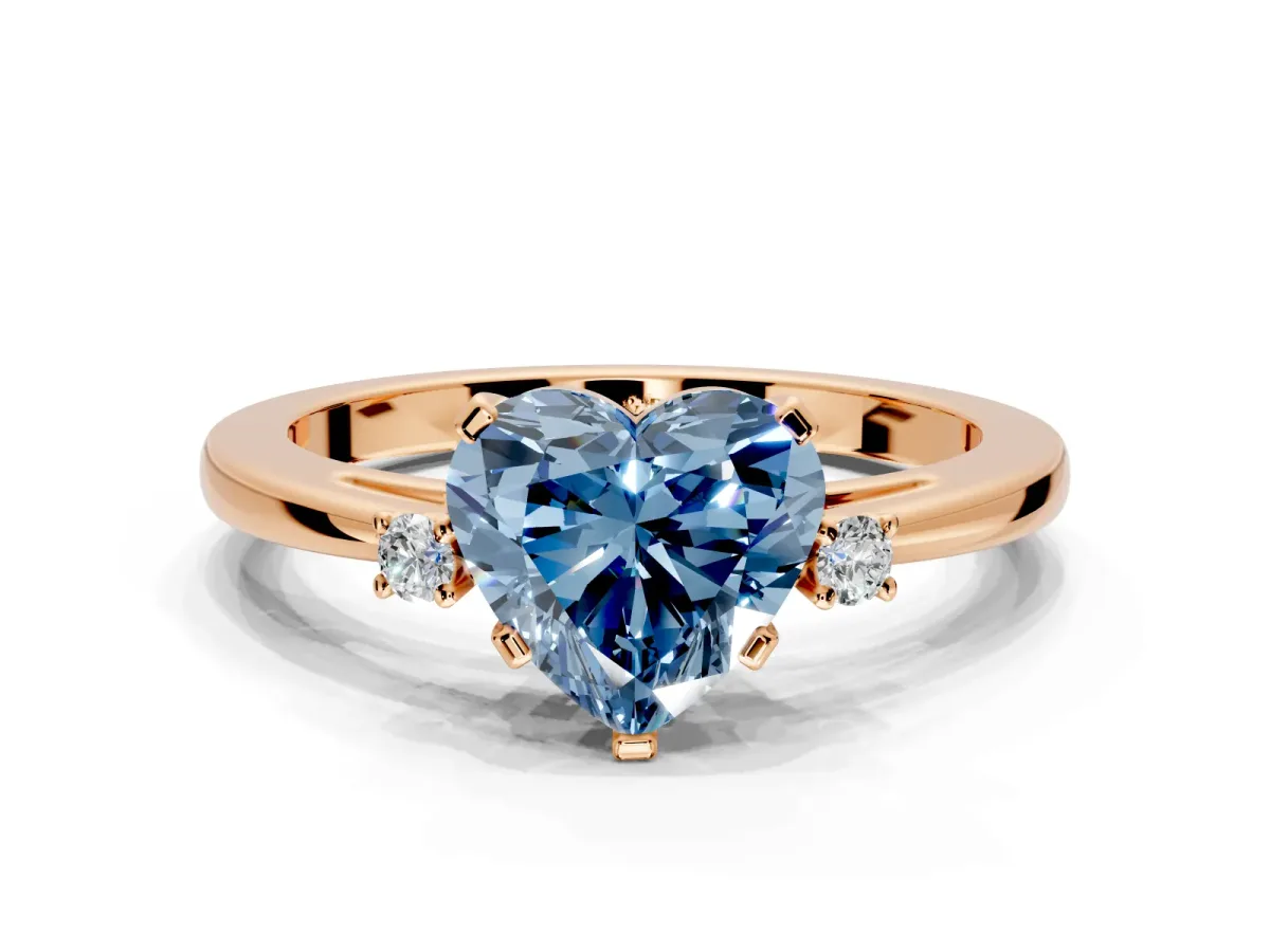 3 Stone Engagement Ring Setting for Fancy Blue Heart-Shaped Center with Low-Set Round Cut Accents and Prong Head in Rose Gold