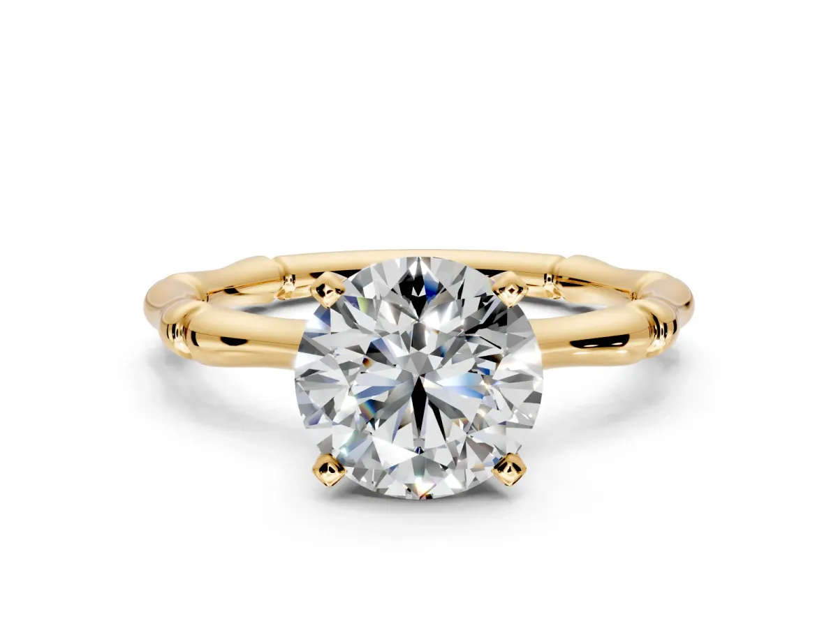 Solitaire Engagement Ring Setting for Round Cut Center with Bamboo Band and Prong Head in Yellow Gold
