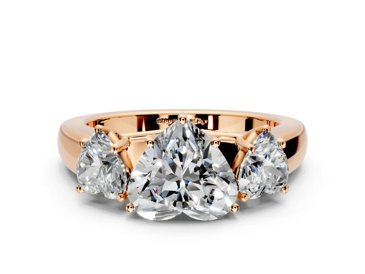 3 Stone Engagement Ring Setting for Heart-Shaped Center with Raised Basket Heads and Prong Head in Rose Gold