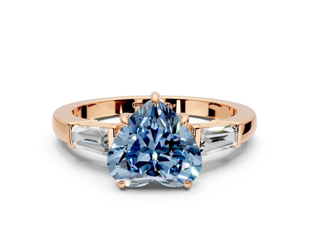 3 Stone Engagement Ring Setting for Fancy Blue Heart-Shaped Center with Baguette Accents and Prong Head in Rose Gold