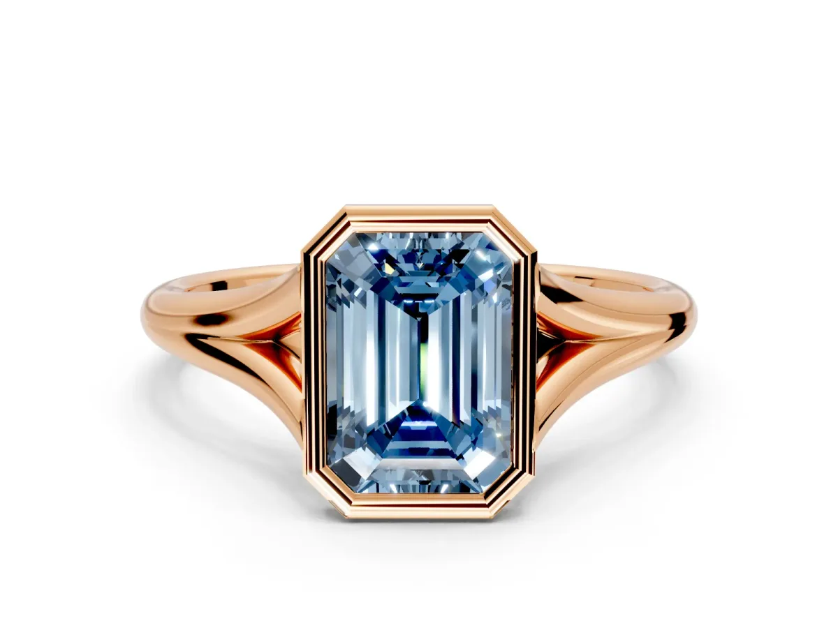 Solitaire Engagement Ring Setting for Fancy Blue Emerald Cut Center with V Split Shank and Bezel Head in Rose Gold