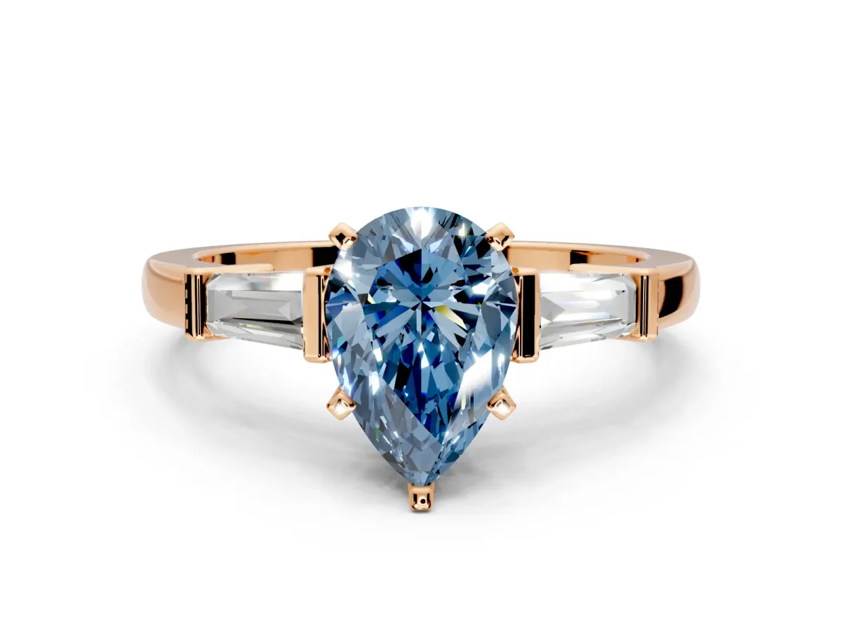 3 Stone Engagement Ring Setting for Fancy Blue Pear-Shaped Center with Channel Baguette Accents and Prong Head in Rose Gold