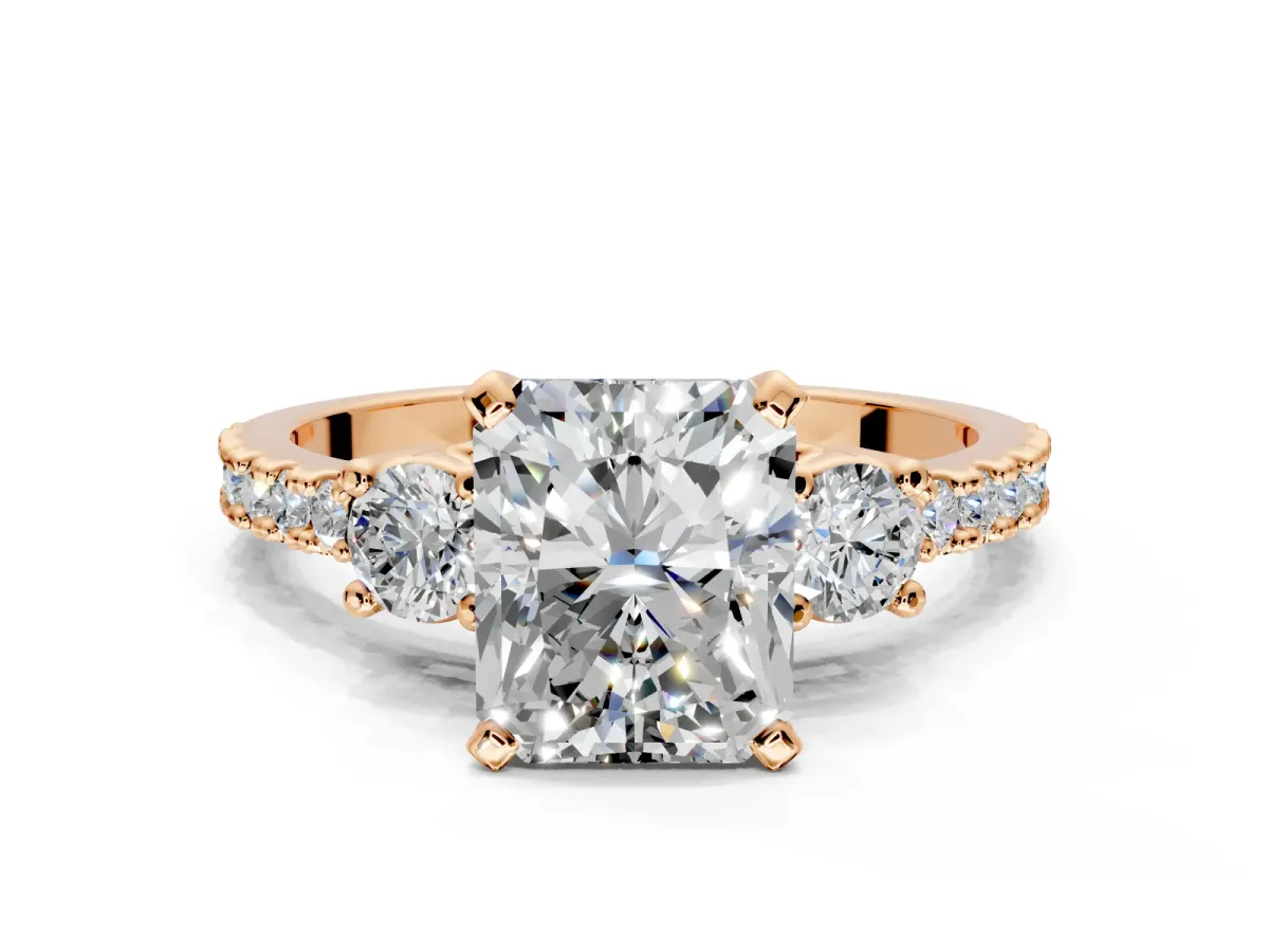 3 Stone Engagement Ring Setting for Radiant Cut Center with Round Cut Side Accents and Prong Head in Rose Gold