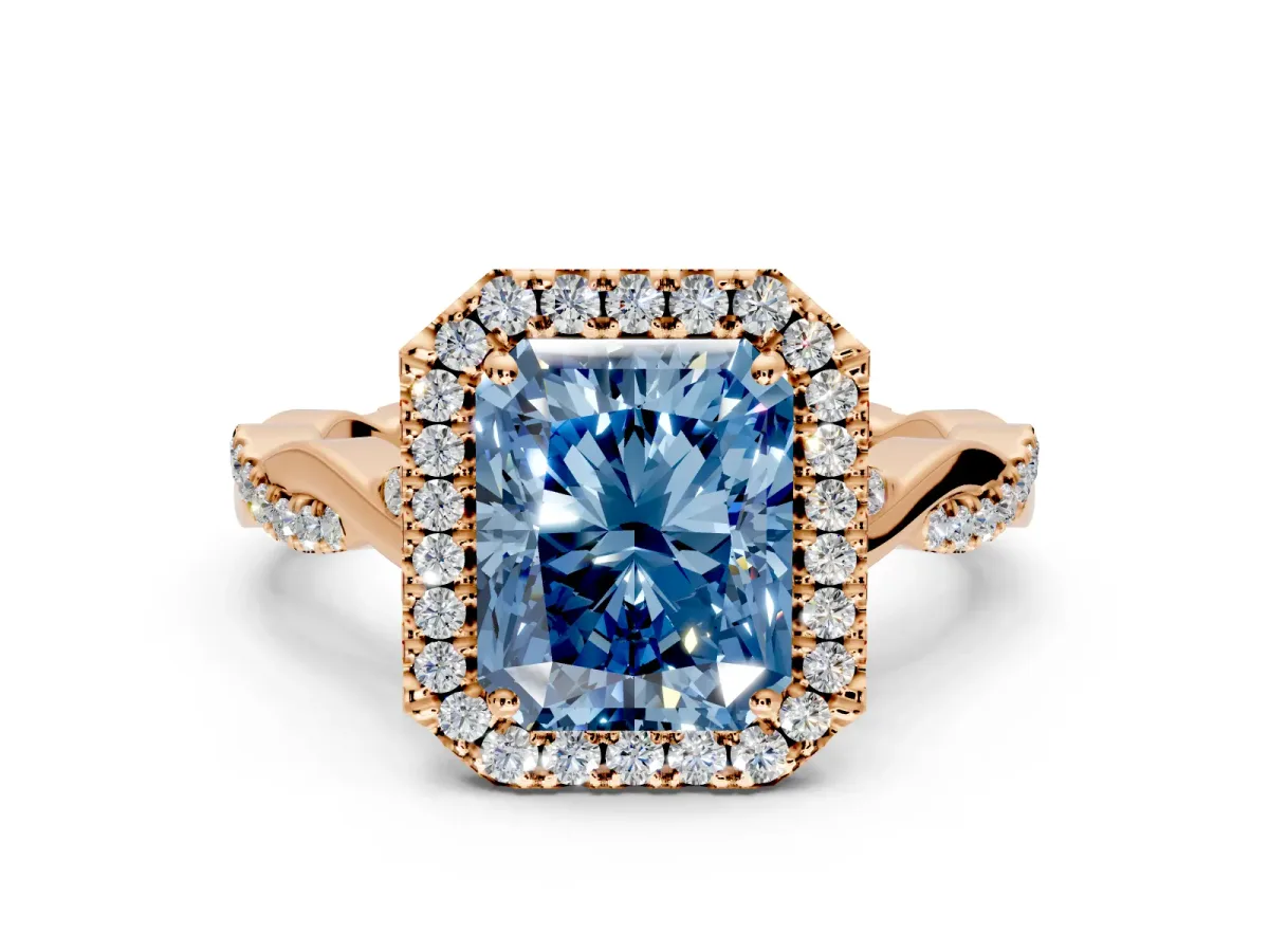 Halo Engagement Ring Setting for Fancy Blue Radiant Cut Center with Twist Band and Prong Head in Rose Gold