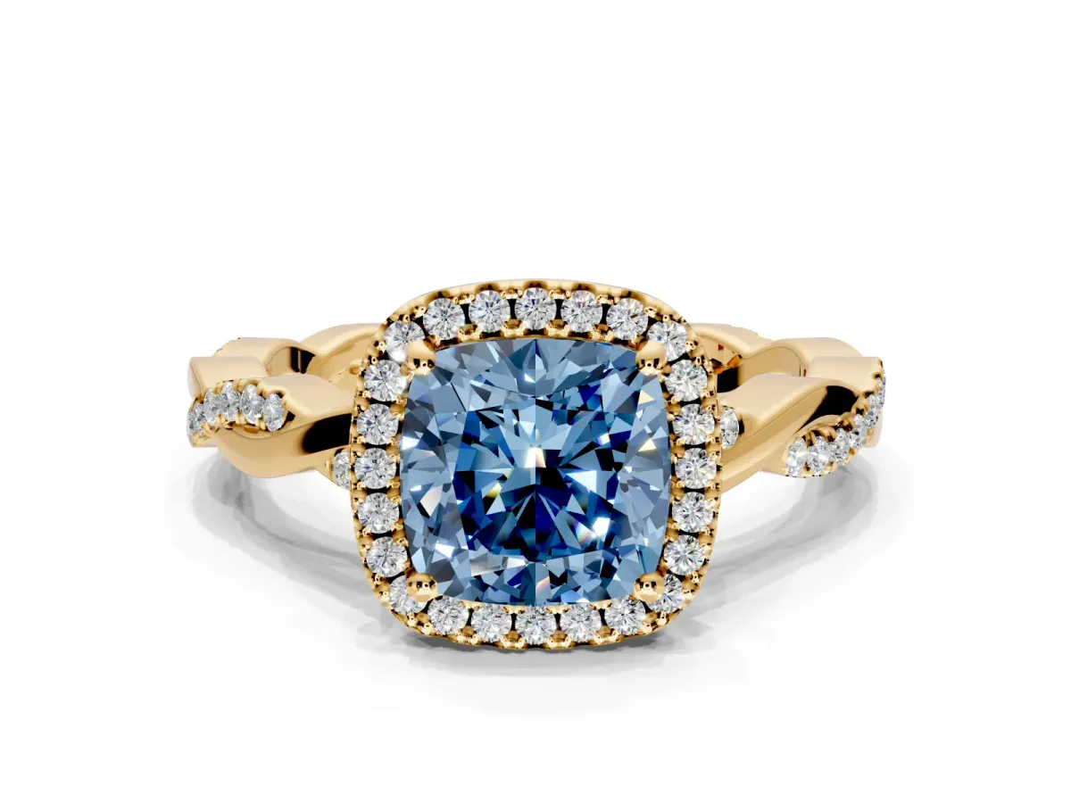 Halo Engagement Ring Setting for Fancy Blue Cushion Cut Center with Pave and Plain Twist Band and Prong Head in Yellow Gold