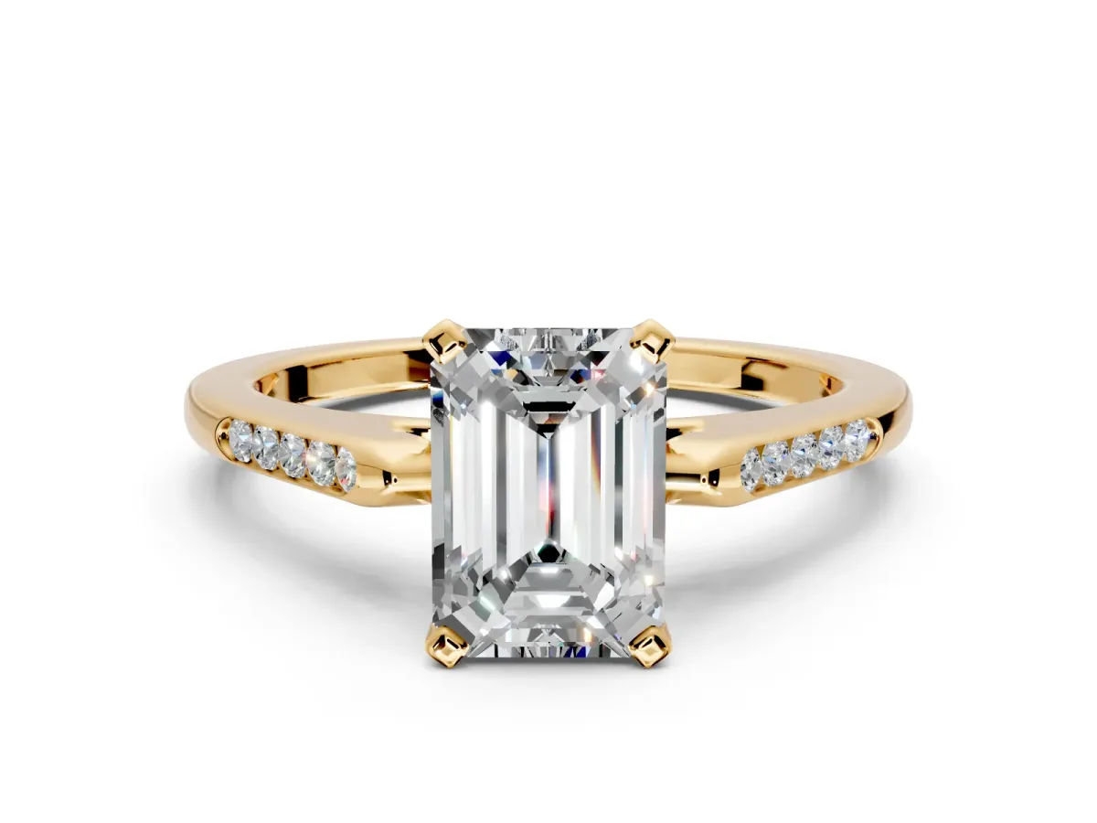 Solitaire Engagement Ring Setting for Emerald Cut Center with Channel Accents and Prong Head in Yellow Gold