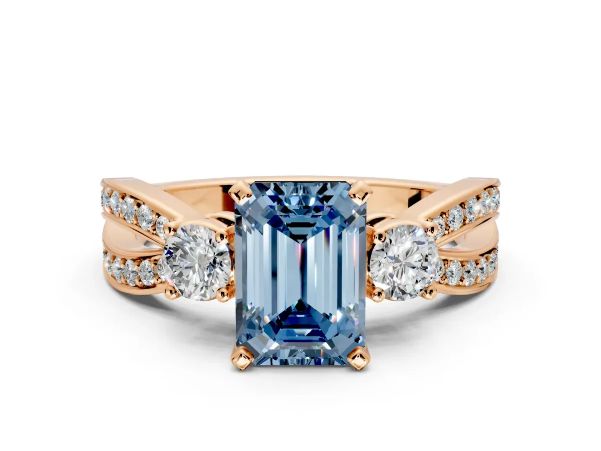 3 Stone Engagement Ring Setting for Fancy Blue Emerald Cut Center with Pave Twist Band and Prong Head in Rose Gold