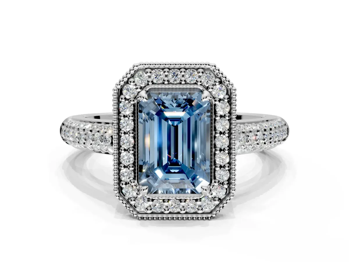 Milgrain Halo Engagement Ring Setting for Fancy Blue Emerald Cut Center with Three-Sided Pave Band and Prong Head in Platinum