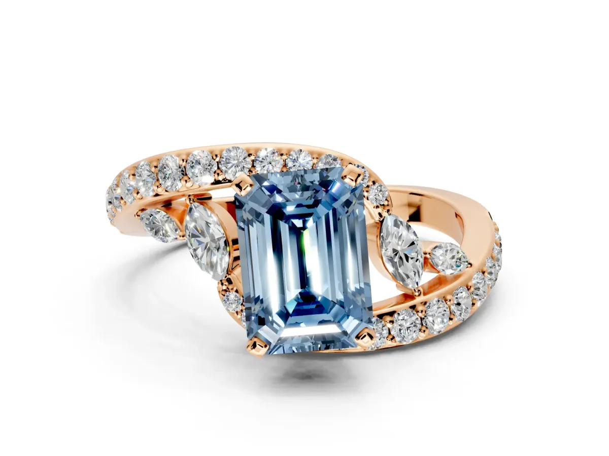 Solitaire Engagement Ring Setting for Fancy Blue Emerald Cut Center with Pave Bypass Twist Band and Prong Head in Rose Gold