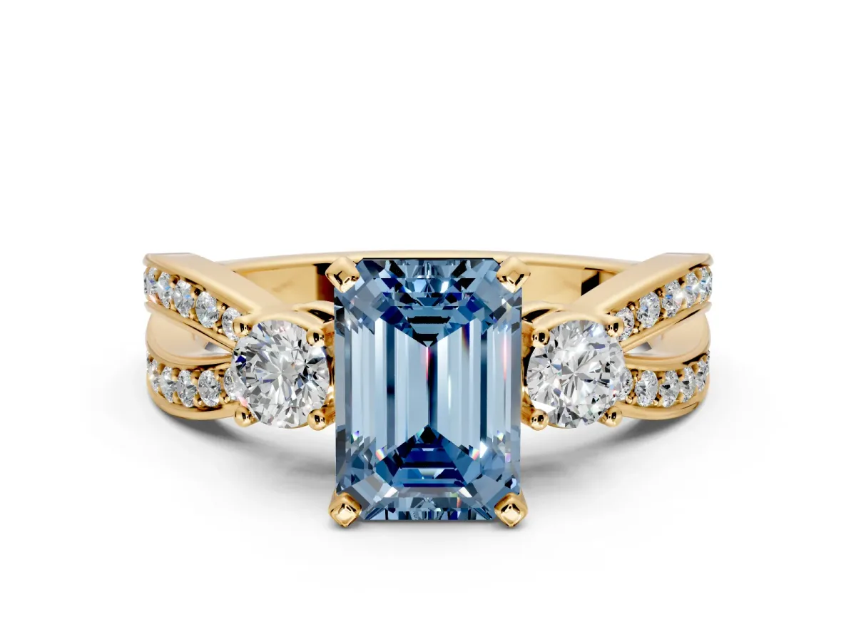 3 Stone Engagement Ring Setting for Fancy Blue Emerald Cut Center with Pave Twist Band and Prong Head in Yellow Gold