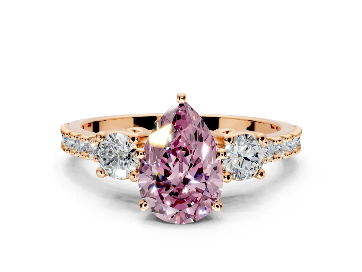 3 Stone Engagement Ring Setting for Fancy Pink Pear-Shaped Center with Round Cut Side Accents and Prong Head in Rose Gold
