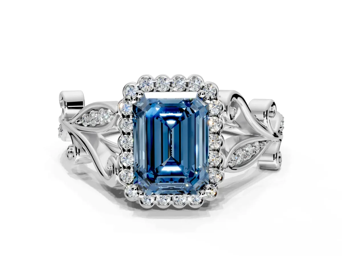 Halo Engagement Ring Setting for Fancy Blue Emerald Cut Center with Leaf Motif Split Shank and Prong Head in Platinum