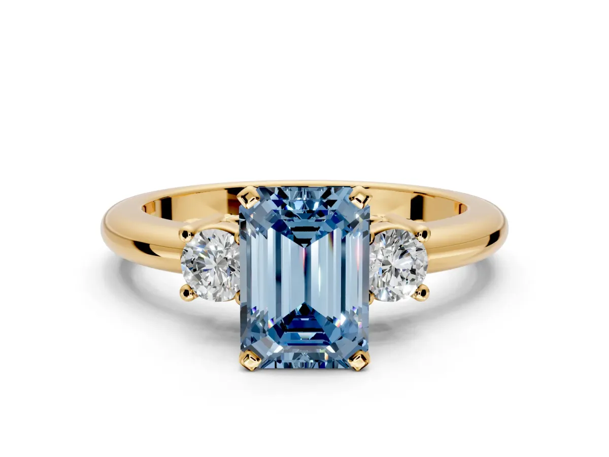 3 Stone Engagement Ring Setting for Fancy Blue Emerald Cut Center with Wide Plain Band and Prong Head in Yellow Gold