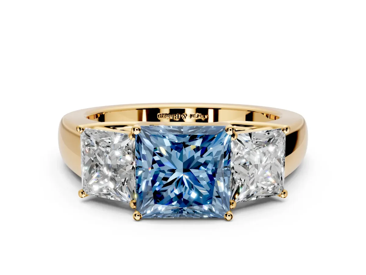 3 Stone Engagement Ring Setting for Fancy Blue Princess Cut Center with Raised Basket Heads and Prong Head in Yellow Gold