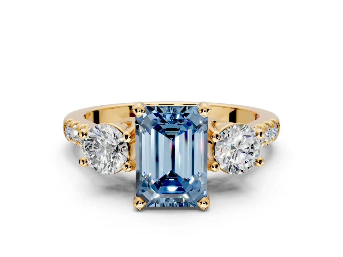 3 Stone Engagement Ring Setting for Fancy Blue Emerald Cut Center with Crossover Basket, Pave Band and Prong Head in Yellow Gold