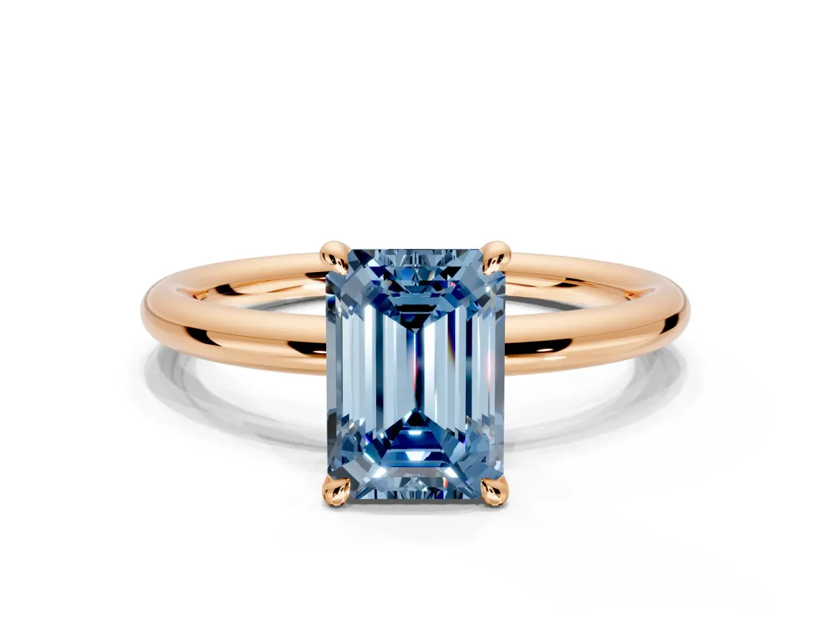 Hidden Halo Engagement Ring Setting for Fancy Blue Emerald Cut Center with Thin Rounded Band and Prong Head in Rose Gold